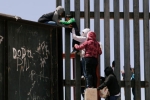 punjabi women, entering US via mexico, video clip shows punjabi women children crossing border fence into u s, U s mexico border